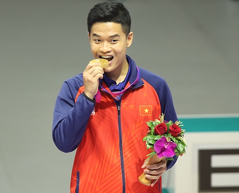 Quang Huy từng giành HCV cho bắn súng Việt Nam tại ASIAD 19. Ảnh: Tuấn Thành